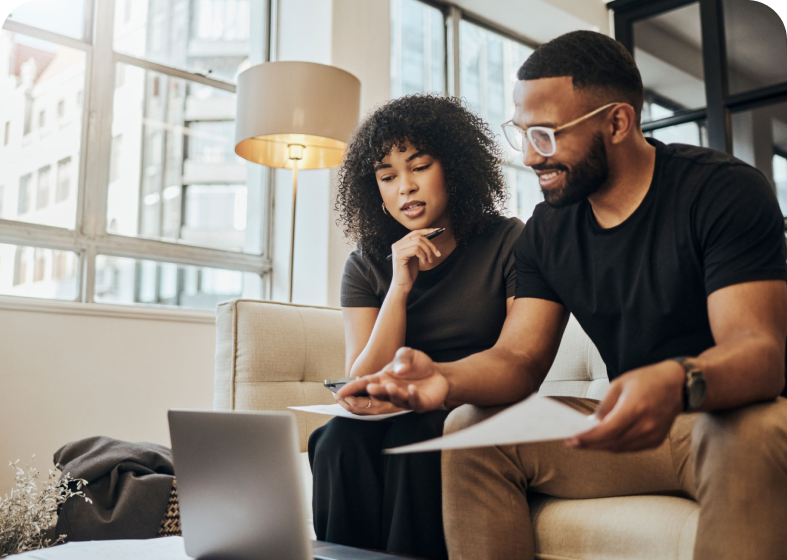 Two people reviewing documents together