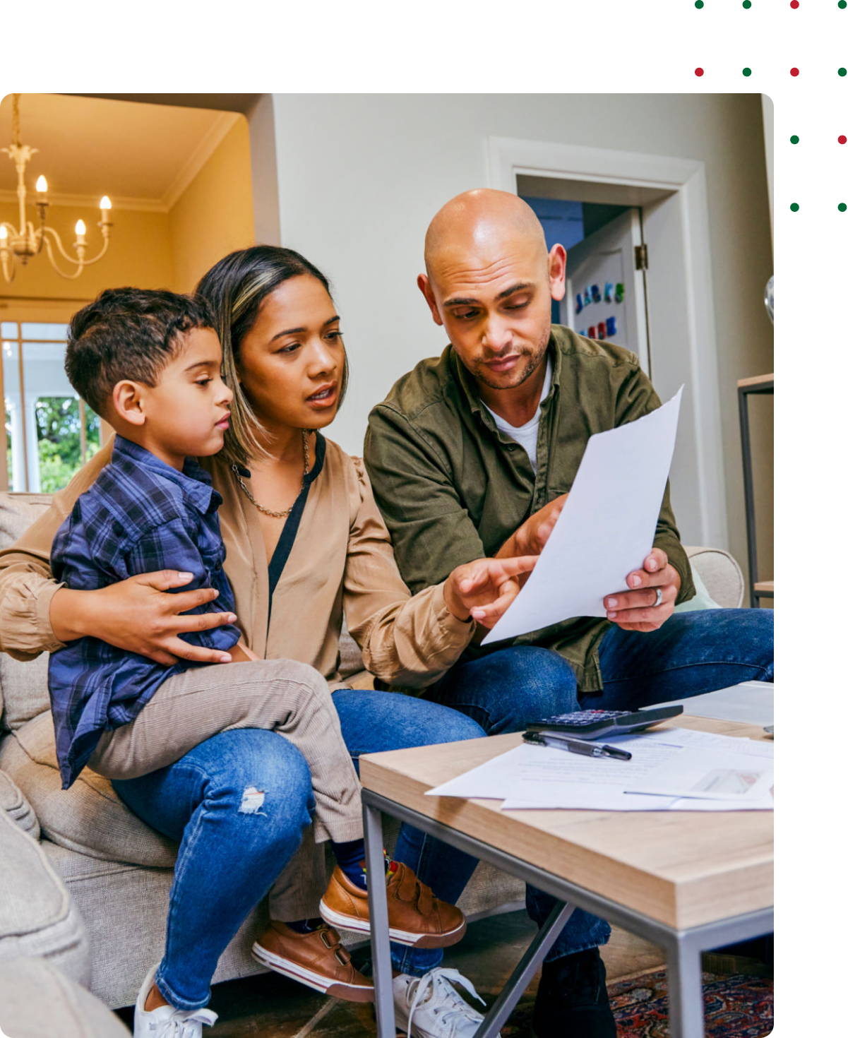 Parents discussing paperwork with child